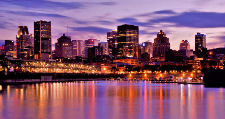 Tourists visit The shimmering montreal canada reflection on the water