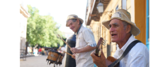 Cuban men playing music for cuban vacation tourists.