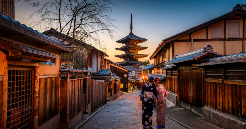 TWO NATIVES TALKING IN THE STREET OF KYOTO