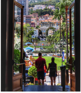 MONACO VACATION TRAVEL TOURISTS LOOKING OUT AT THE ICONIC MONACO LANDMARK