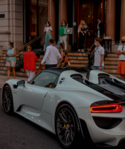 People enjoing their Monaco vacation on the steps of an iconic building