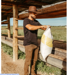 DUDE RANCHER WORKING IN THE CORALE